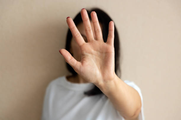 istock woman shows stop sign with hand 1403692336