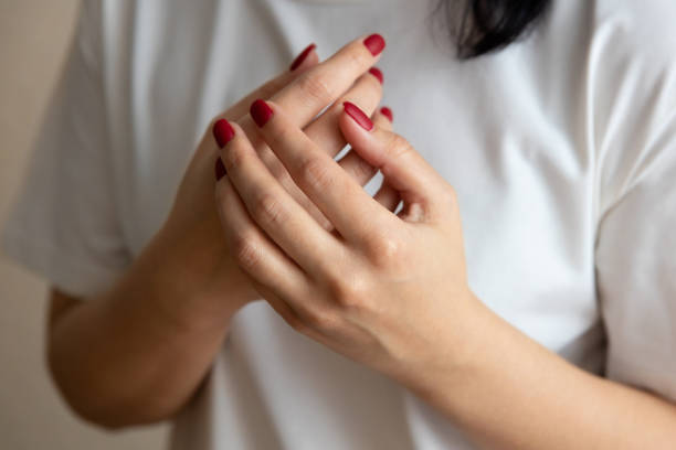 istock pain in the arm. Womens hands 1403692405