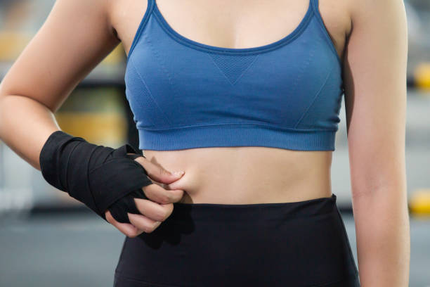 istock Woman touching on fat belly. 1403692675