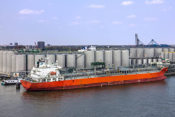 Quayside, pier of refinery and LNG storage tanks - port of Antwerp