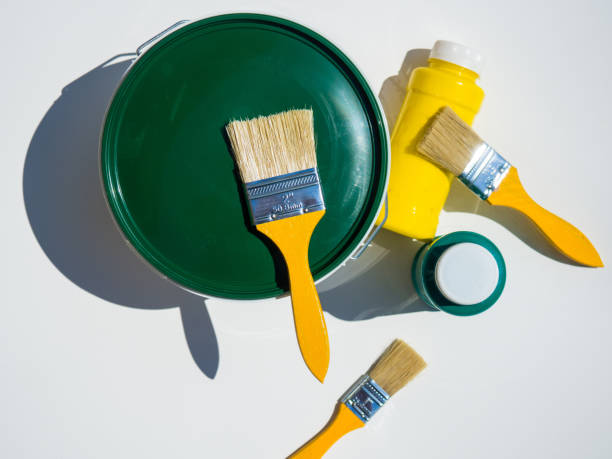 istock Necessary tools for painting walls: paint rollers and tray, brush and paints. 1403695835