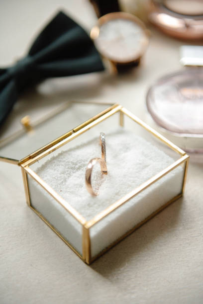 istock Wedding rings on a light background in a wooden box 1403696308