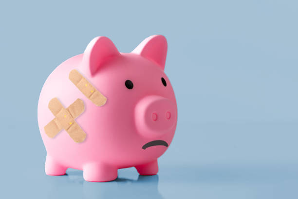 istock Piggy bank with a Band-Aid on it 1403704487