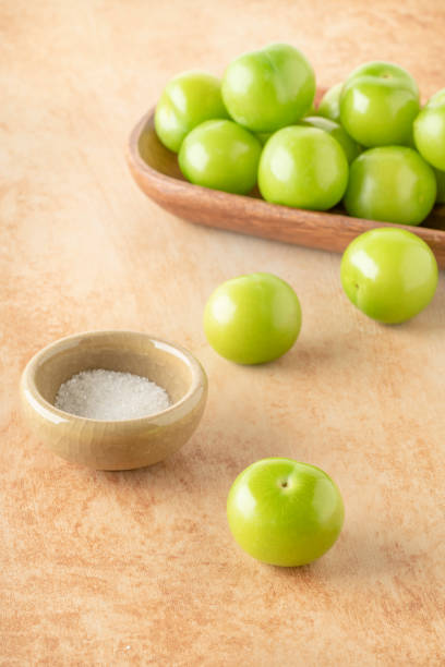 istock side view ripe green plum fruits served with salt on table 1403705317