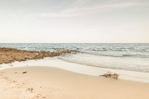 Ocean Waves Splashing Along the Empty Rocky Beach Shoreline at Sunset in Singer Island, Florida in June of 2022