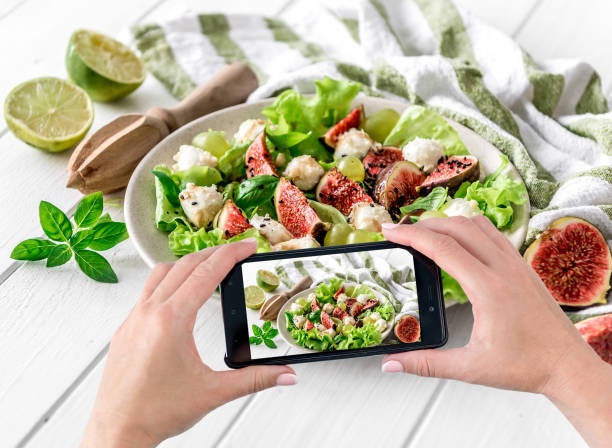 istock Women's hands photograph vegetarian salad 1403706577