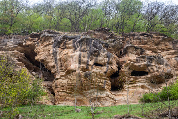 Cheese rock with caves, so named because of the bizarre forms of sandstone weathering, North Caucasus, Karachay-Cherkessia