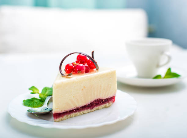 delicious piece of cheesecake and white cup