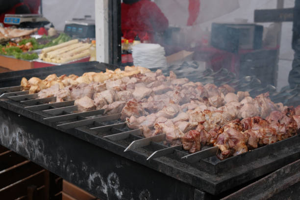 istock Roasting juicy meat steak with spices in burning charcoals fire on bbq grid 1403708832