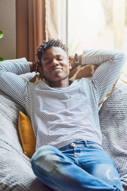 istock Young African man relaxing at home. 1403709033