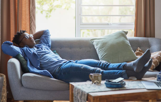 istock Young African man relaxing at home. 1403709153