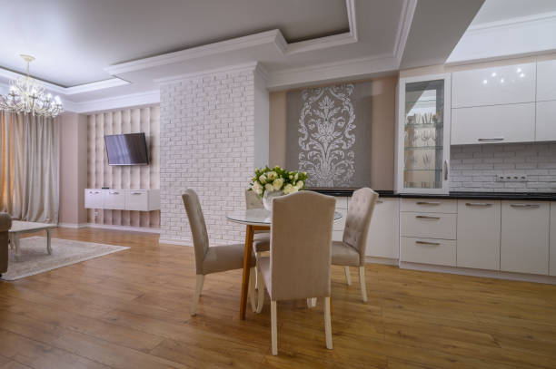 istock Luxury white modern kitchen with rose walls in studio apartment 1403712809
