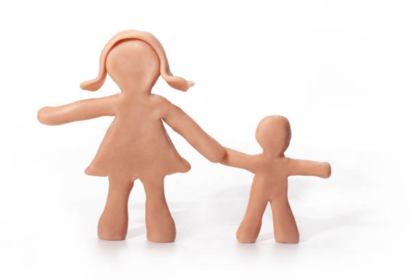istock mother and son clay figurines holding hands 1403712872