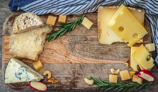 Tasty cheese assortment with copy space, top view