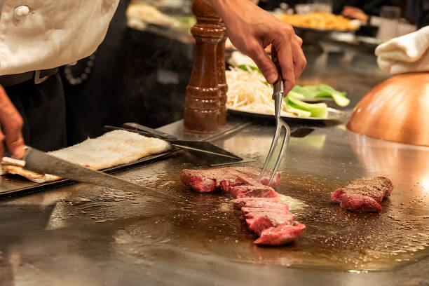 istock Kobe steak being cooked at a Japanese teppanyaki restaurant 1403719835