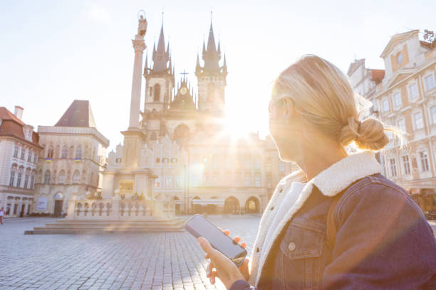 istock Young woman in Prague using a mobile phone 1403720251