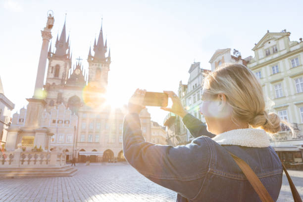 istock Young woman in Prague using a mobile phone 1403720828