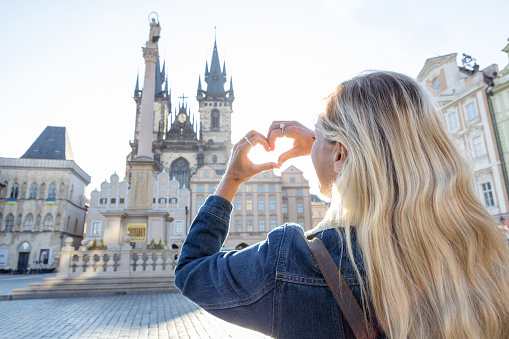 Solo travel woman exploring the city and the famous landmark. \nPrague, Czech Republic