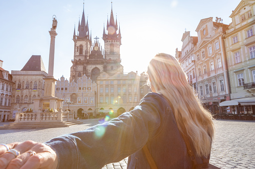Travel couple exploring the city and the famous landmarks. \nPrague, Czech Republic