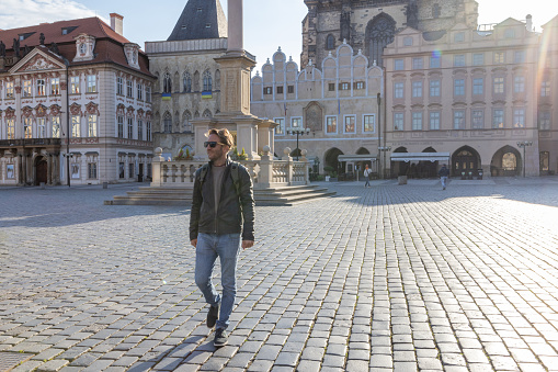 Young man wandering in the city streets of Prague
