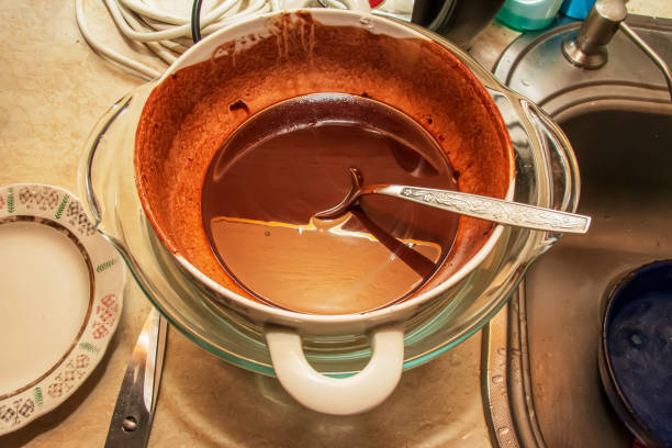 istock Homemade hot chocolate is ready to be poured into silicone molds. 1403722006