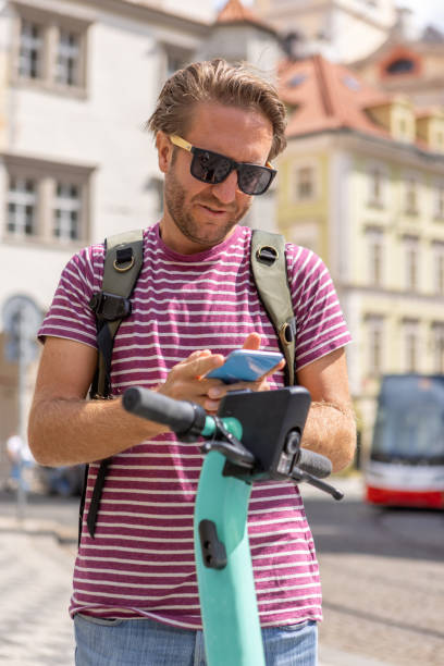 istock Activating electric scooter from smart phone 1403722108