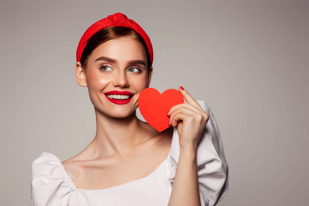 istock Beautiful emotional woman holding present box 1403726261
