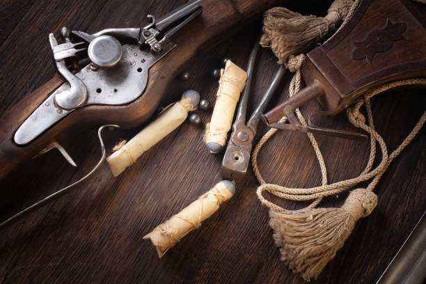istock 17th century ancient flintlock musket with powder flask and led bullets. 1403726463