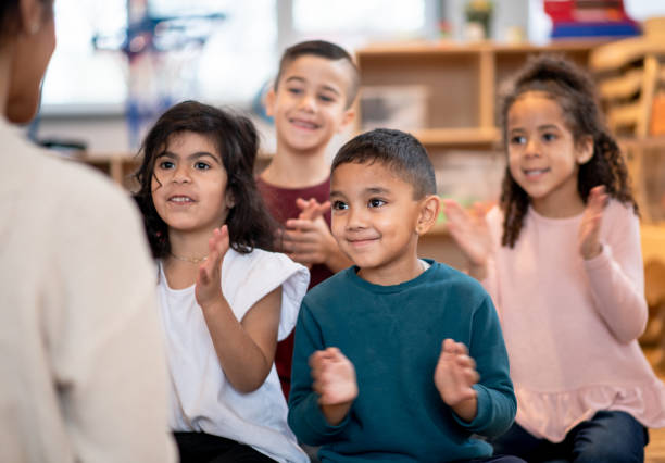 istock Daycare kids clap their hands 1403734901