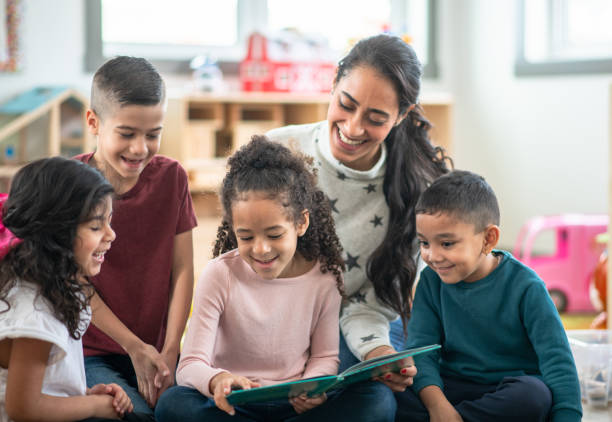 Daycare kids having fun reading together