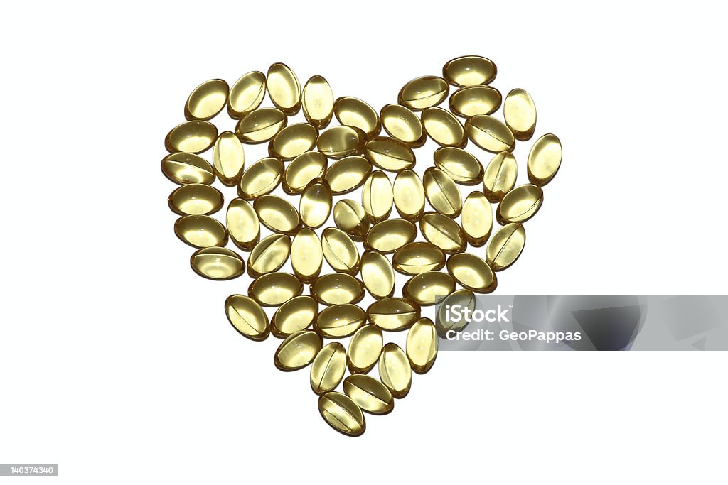 Healthy Heart Vitamin capsules arranged in the shape of a heart to portray the concept of a healthy heart and lifestyle Antioxidant Stock Photo