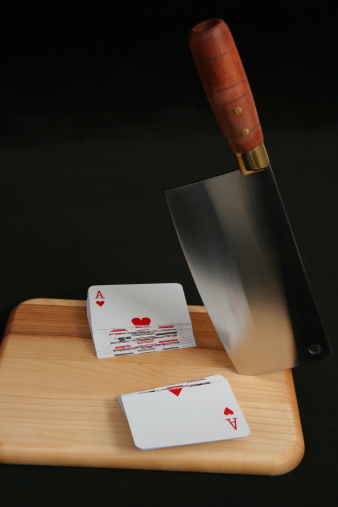 Picture of a cut deck of cards. With a cleaver. 