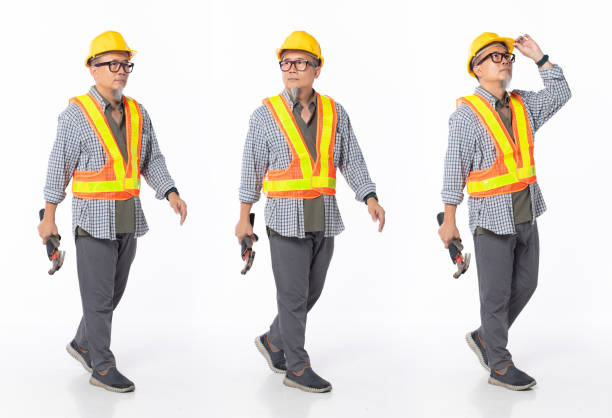 istock Full length 50s 60s Asian Chinese contractor builder engineer man, walking forward left right 1403748245