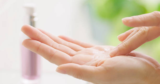 istock woman applying cream 1403749029