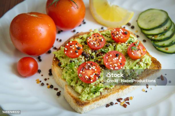 Healthy Toast With Avocado Stock Photo - Download Image Now - Avocado, Toasted Bread, Tomato