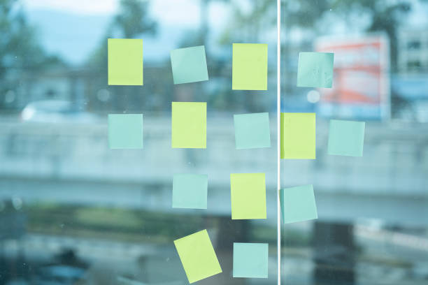 istock Colored paper pasted on glass can put text in business idea. 1403752981