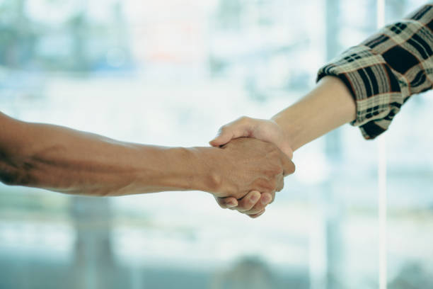 istock business people shaking hands for business merger teamwork Successful negotiations shake hands to celebrate partnership and business agreement ideas. 1403752983