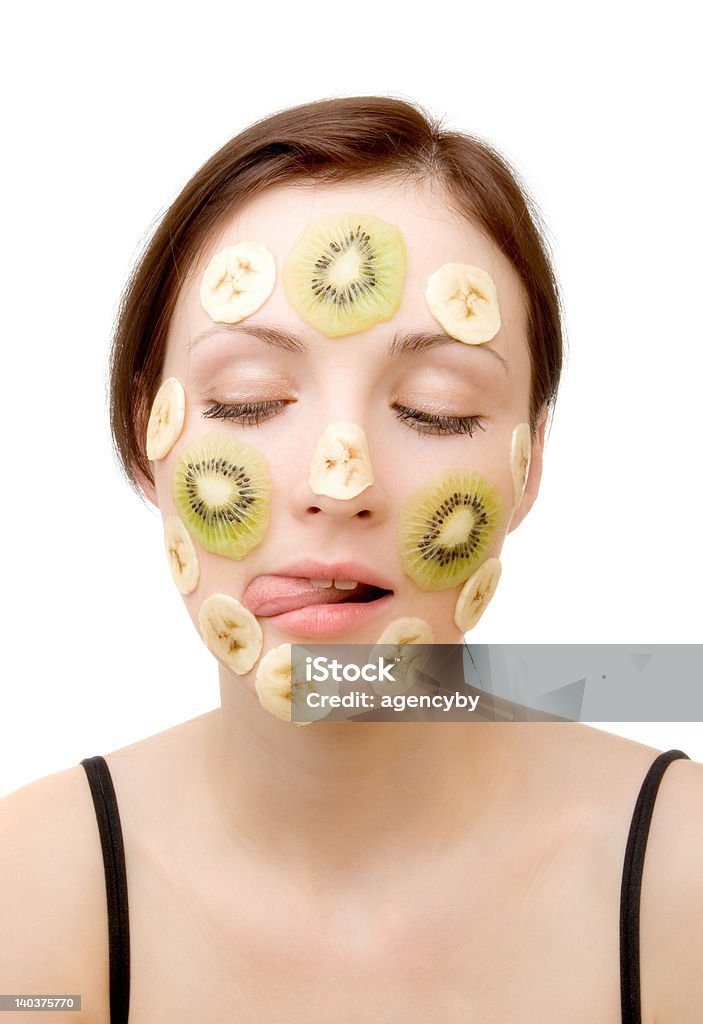 Attractive woman Face Treatment Young Woman with Fruit Mask on Her Face Adolescence Stock Photo