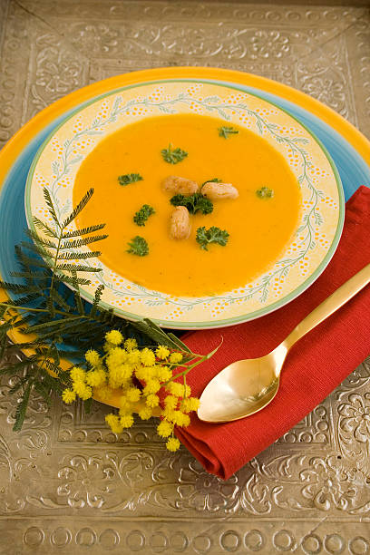 istock Pumpkin-carrot soup with Golden spoon 140376000