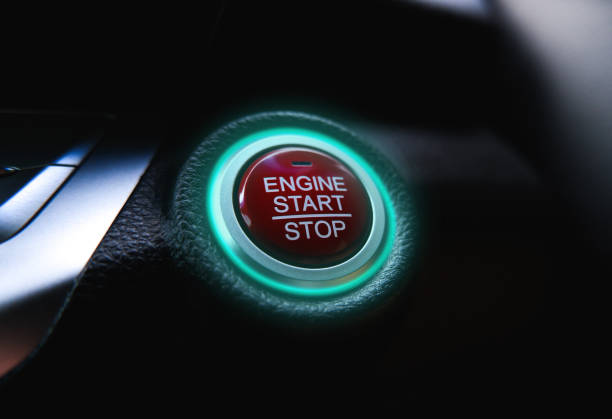 istock The electric car engine start stop button is illuminated by a green light 1403760547