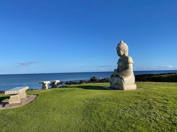 istock Stone Buddha statue sitting by the sea 1403760677