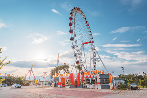 19 May 2022, Antalya, Turkey: Heart of Antalya ferris wheel in amusement park against sky background. Entertainment and fair concept.