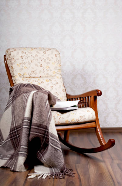 istock modern rocking chair near a light wall 1403763723