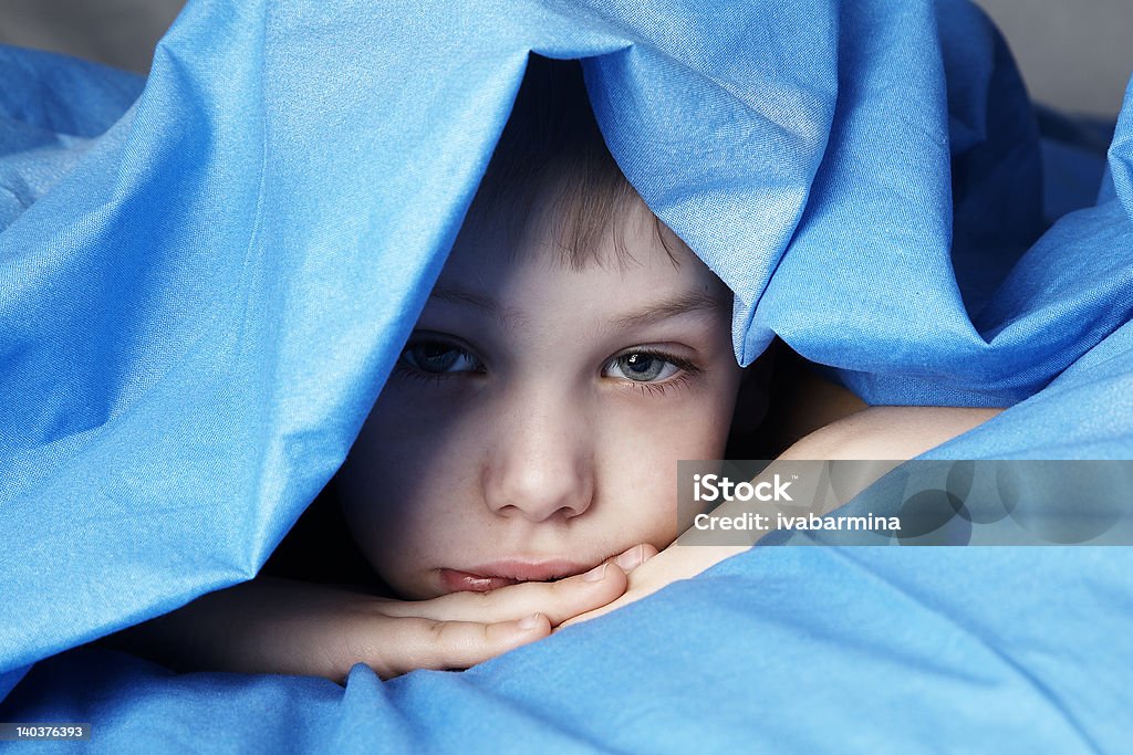 sleepy boy sleepy boy in blue bedclothes Animal Body Stock Photo