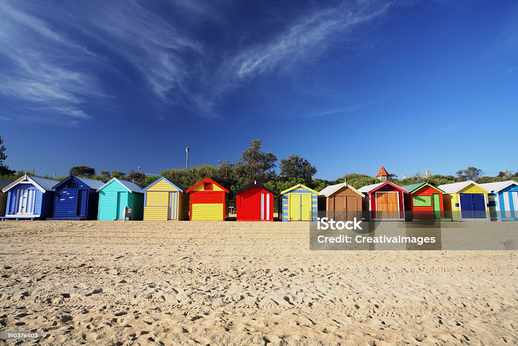 A landscape view of colorful beach huts in a row Colorful beach huts at Brighton Beach near Melbourne, Australia Absence Stock Photo