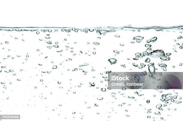 Water With Bubbles Of Air Floating To The Surface Stock Photo - Download Image Now - Abstract, Blue, Breaking Wave