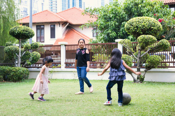 istock Children playing football in the front yard 1403769964