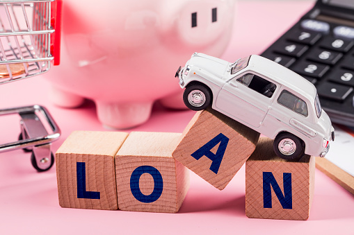 Home loan car loan conceptLoan to buy a car to buy a house