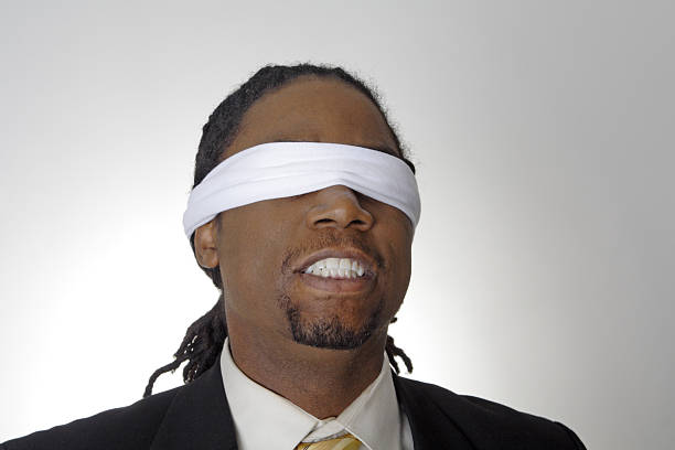 istock African American Man Gritting Teeth Wearing Blindfold 140377199