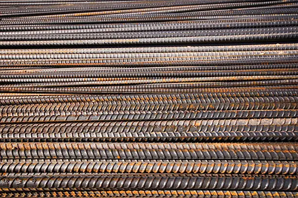 Pile of rebar on a job site waiting to be installed